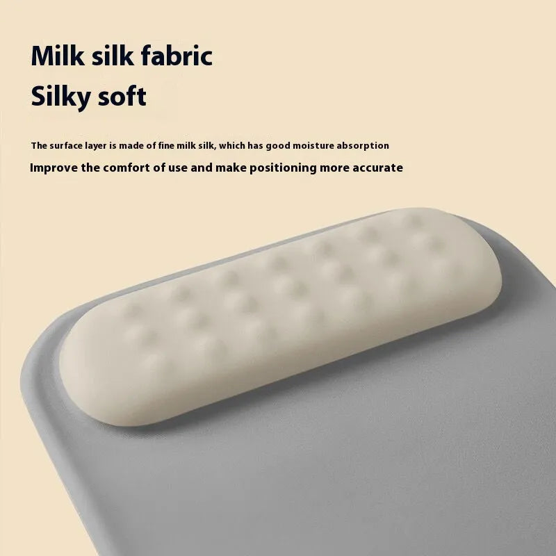 Ergonomic mouse pad with built-in wrist rest in various colour options on a desk
