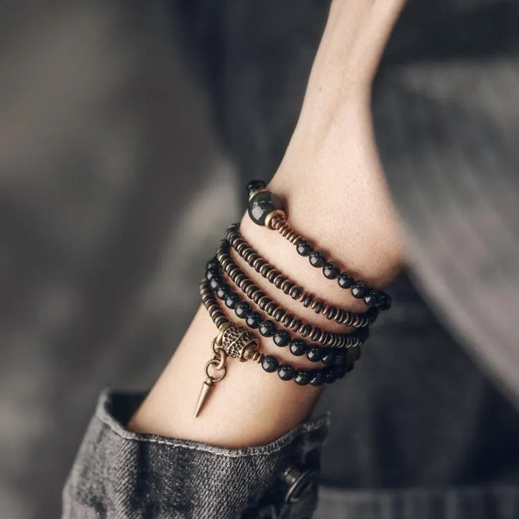 Geometric black beaded multi layered bracelet with natural styling elements