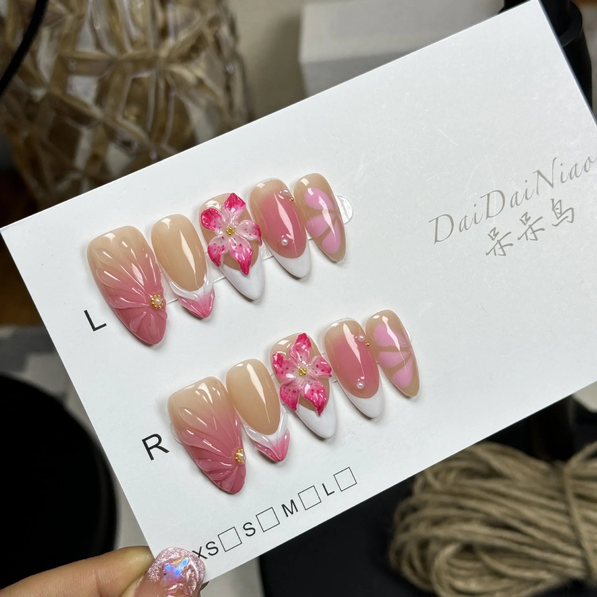 French style 3D lily ice flower design on almond-shaped plastic false nails.