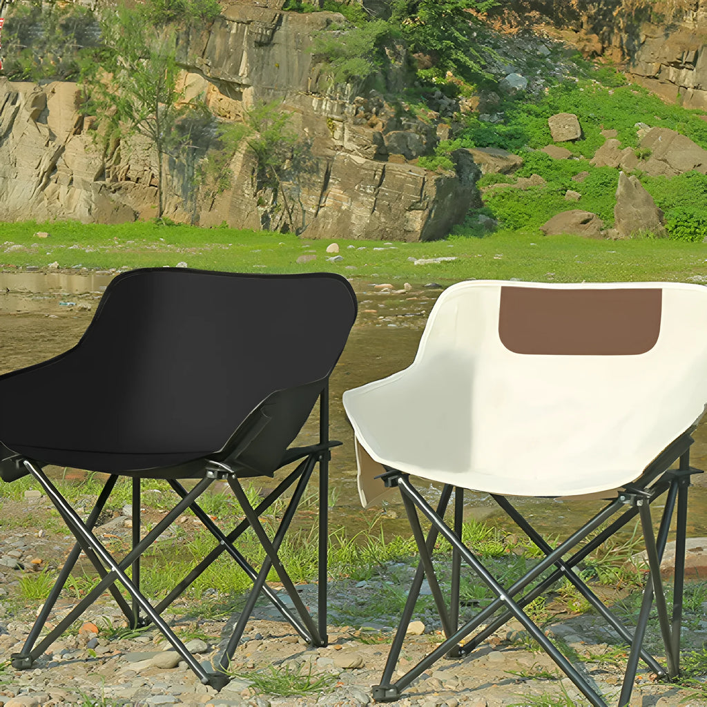 Beige folding camping chair with steel frame and Oxford cloth seat in outdoor setting