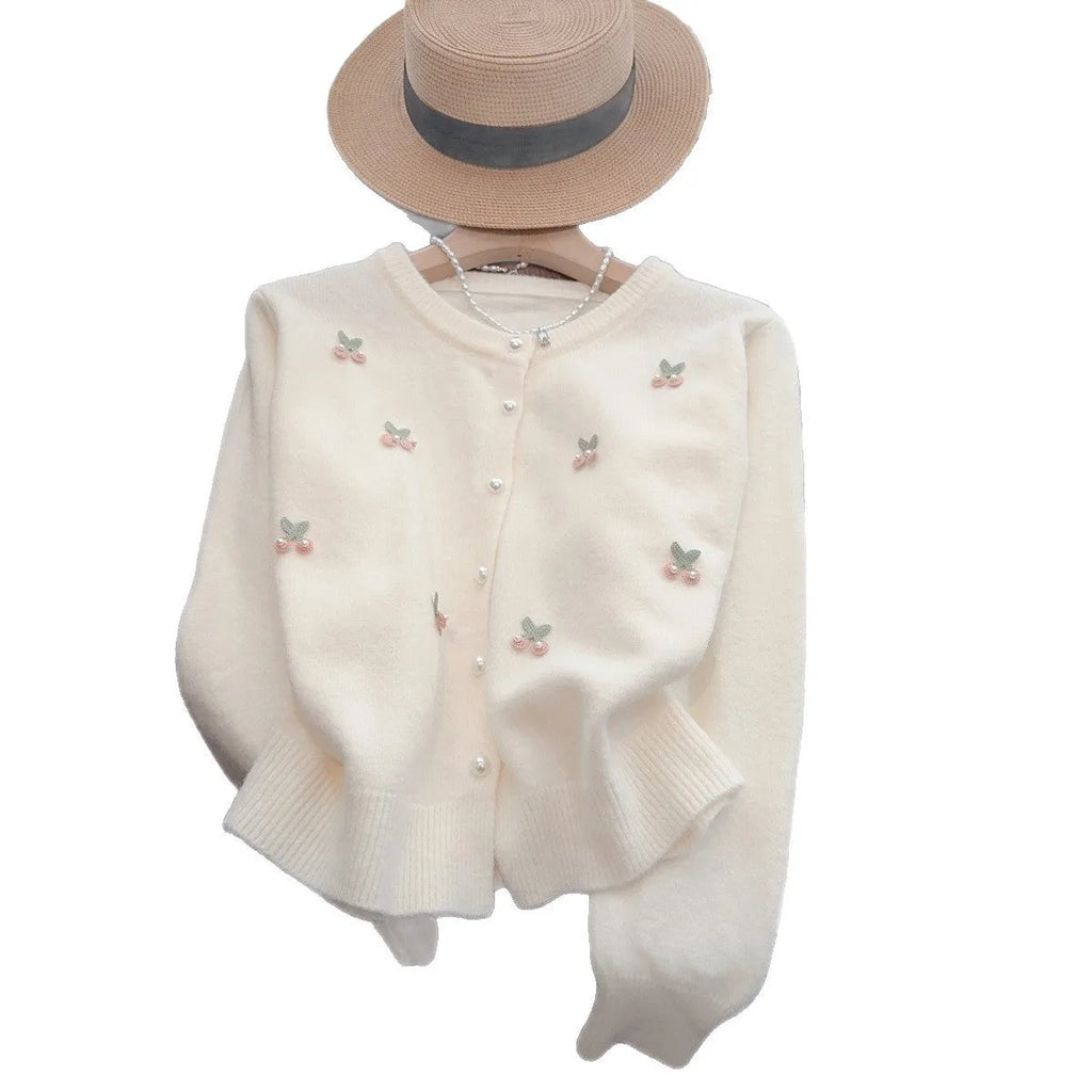 Women's soft pink cashmere blend cardigan coat with round neck, beaded detail, and slim fit.