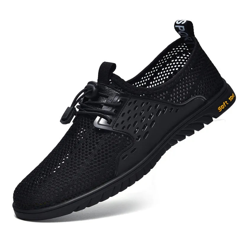 Men's black mesh casual shoes with elastic band and rubber sole on a white background
