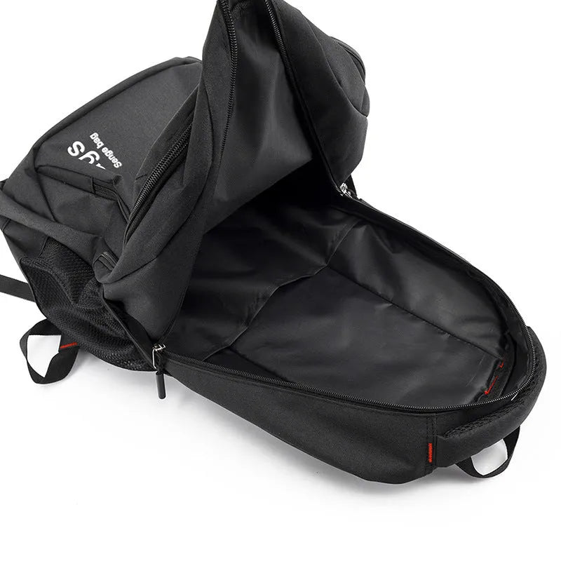 Black nylon backpack with multiple zippers and double shoulder straps shown open to reveal internal laptop and organisation compartments.