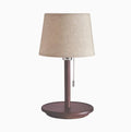 Walnut colour solid wood bedside lamp with fabric shade and pull cord switch