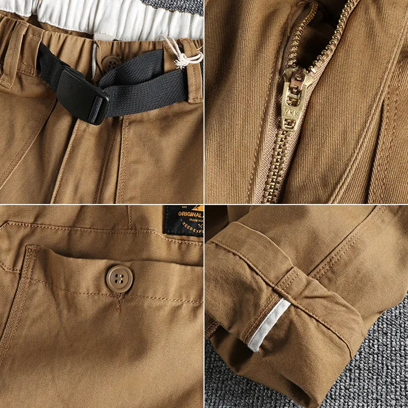 Men's khaki cotton work trousers with an N I buckle belt on a mid waist.