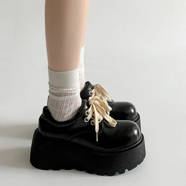 Women's matte black lace-up shoes with thick rubber sole and chunky 6-8cm heel, round toe.