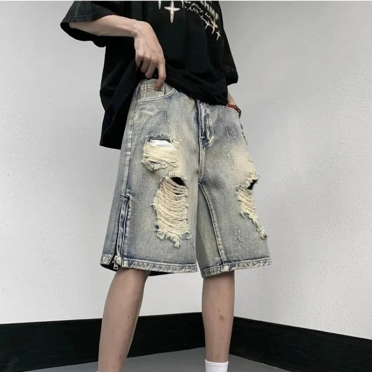 Blue retro tattered denim shorts with wide leg fit and distressed detailing