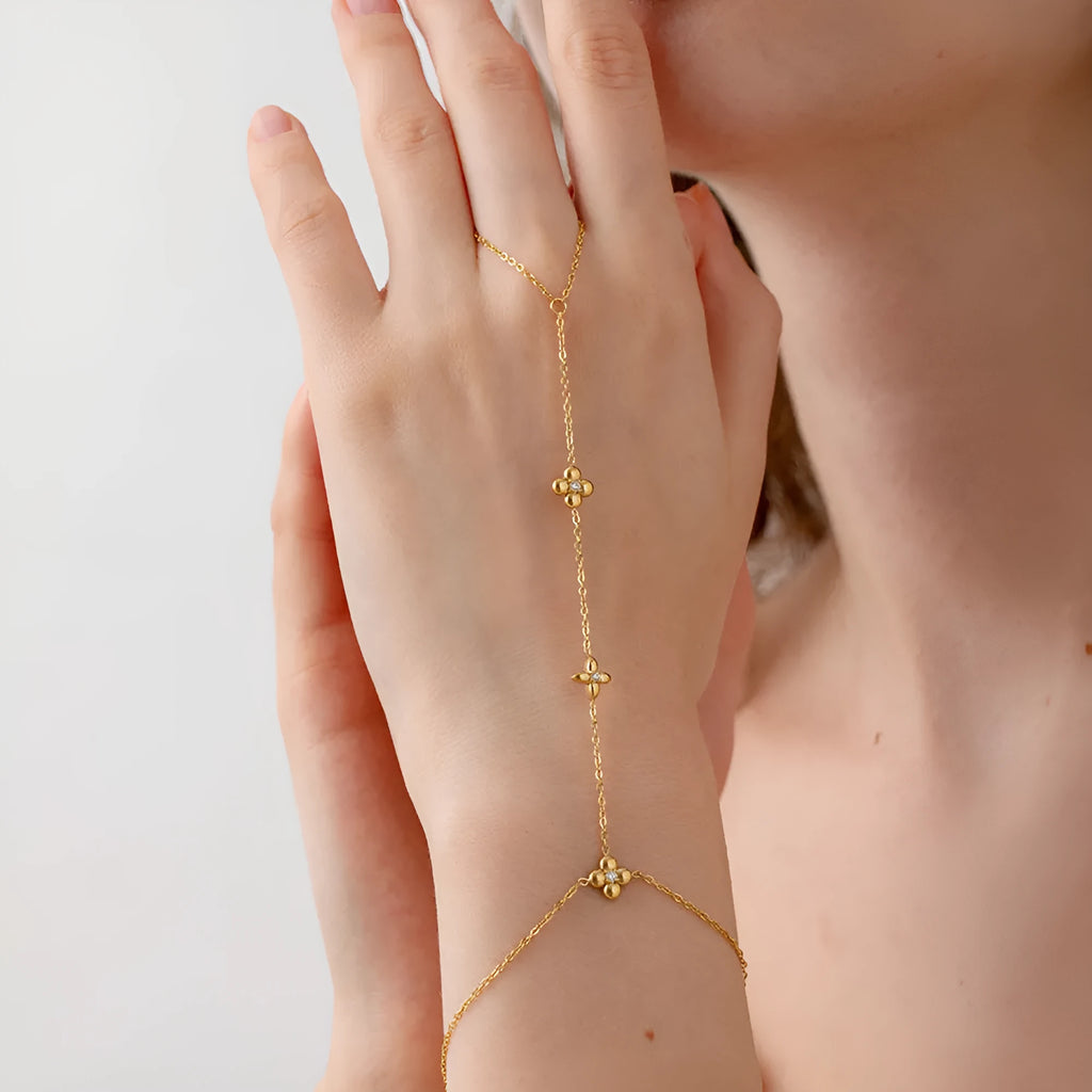 Gold stainless steel women's bracelet with eight-pointed stars and floral geometric design