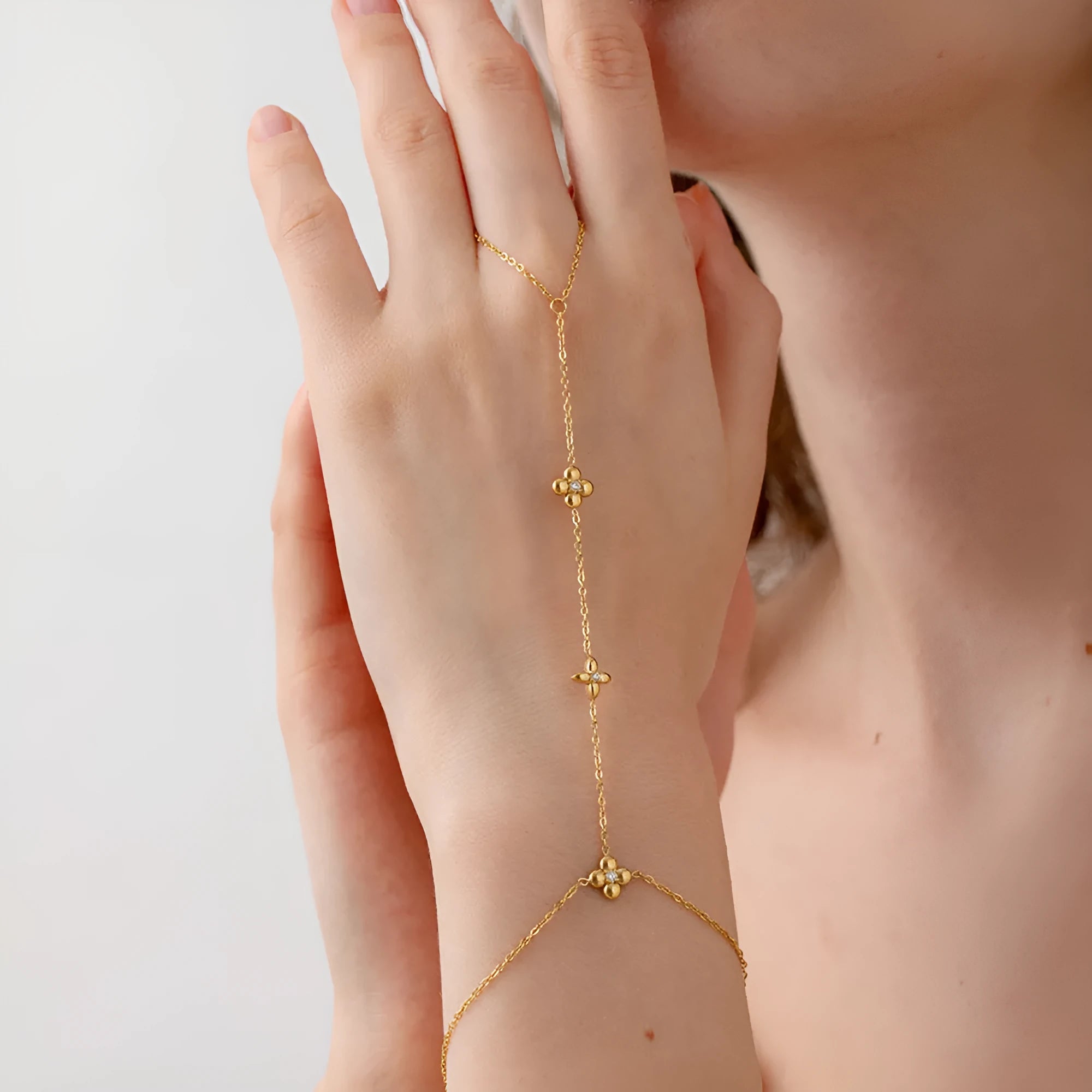 Gold stainless steel women's bracelet with eight-pointed stars and floral geometric design