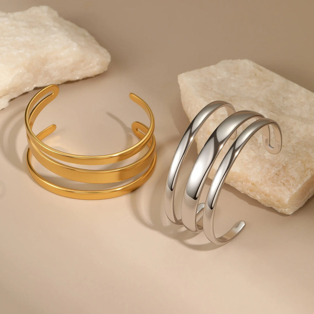 Stainless steel women's bracelet with geometric design and 18K gold electroplating in gold and steel colour options