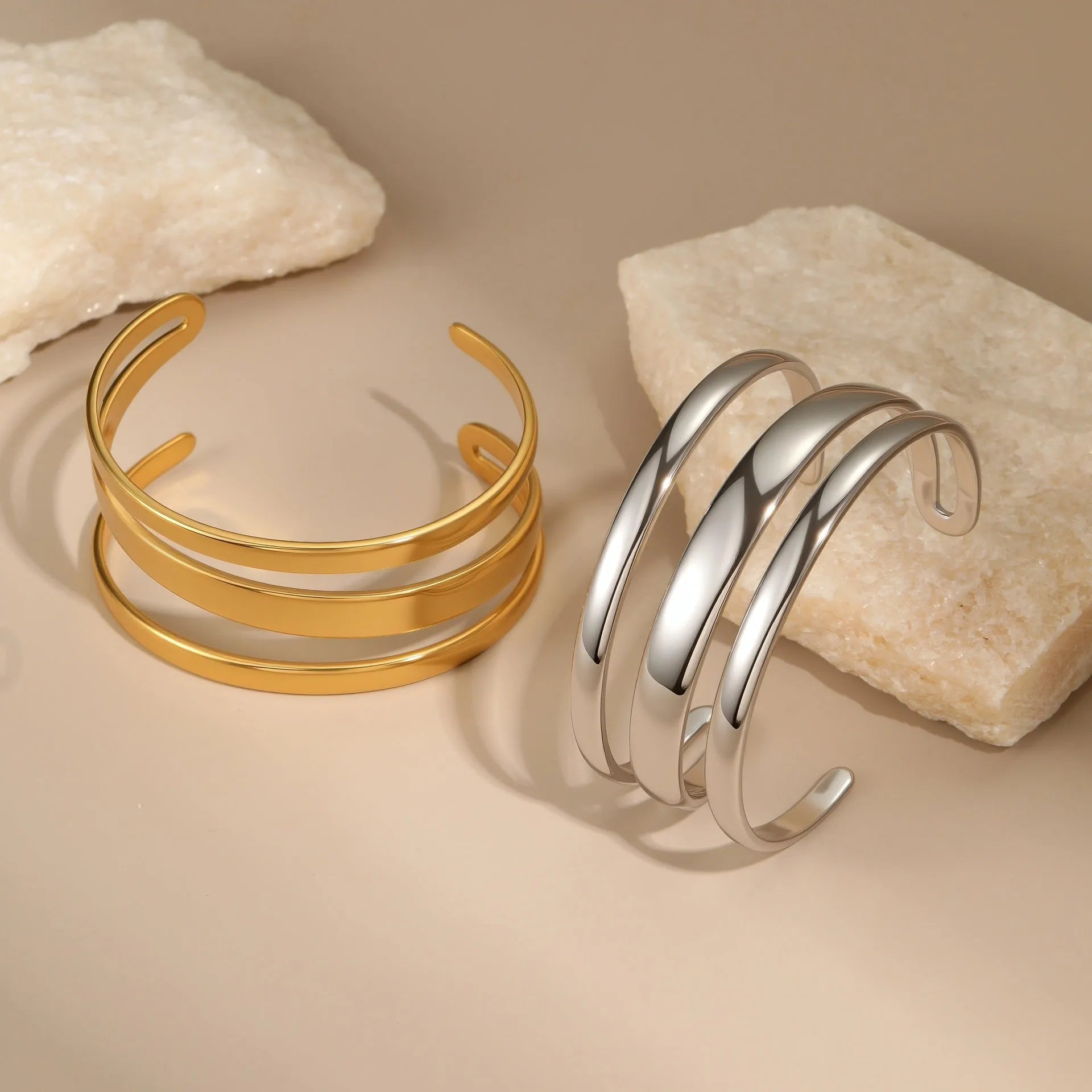 Stainless steel women's bracelet with geometric design and 18K gold electroplating in gold and steel colour options