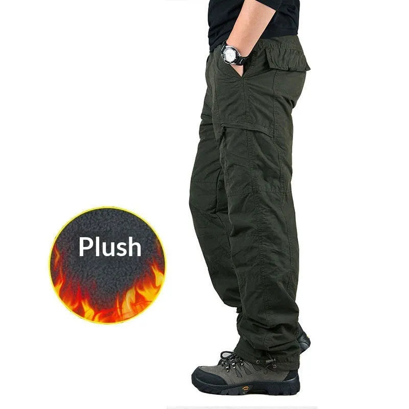 Man wearing thickened warm windproof waterproof fleece lined cotton trousers in army green with belt and double-layer waistband
