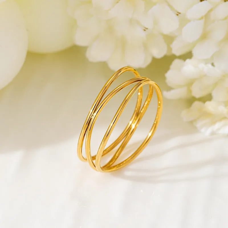 Three-layer geometric coil gold ring in electroplated titanium steel women's jewellery