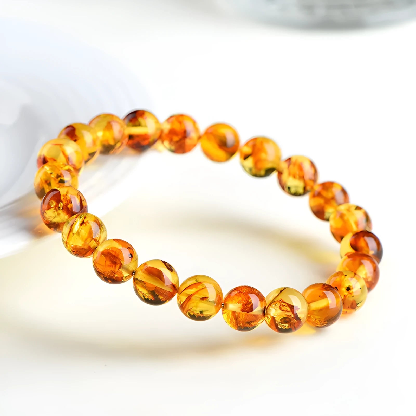 Natural yellow piebald amber bracelet with flower spot patterning in three bead size options