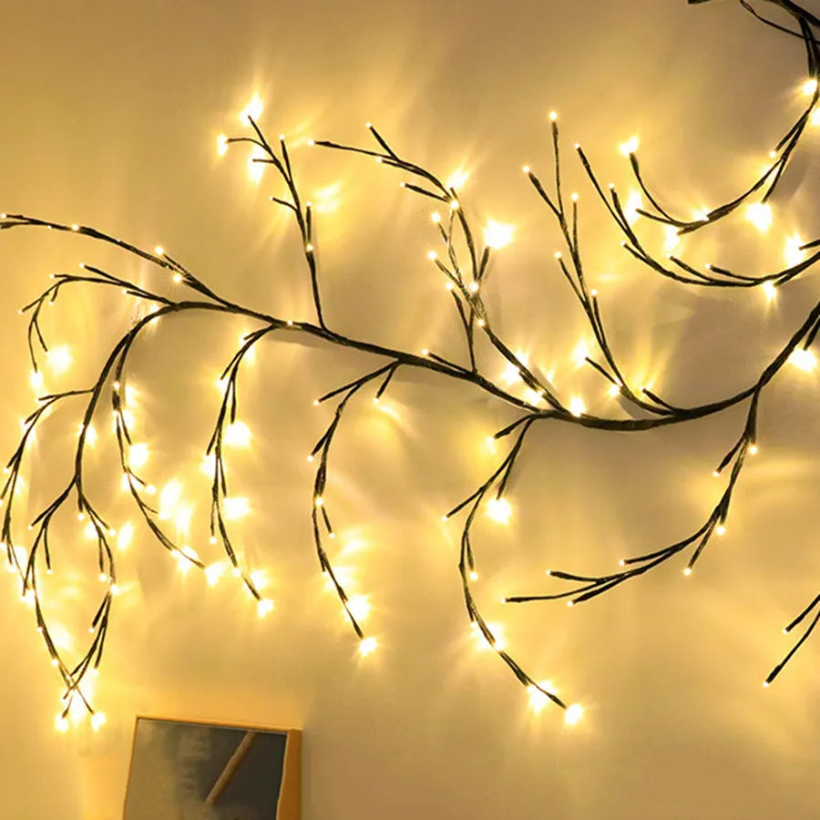 Flexible Christmas vine garland with warm white LED lights and birch bark texture bent into decorative shape