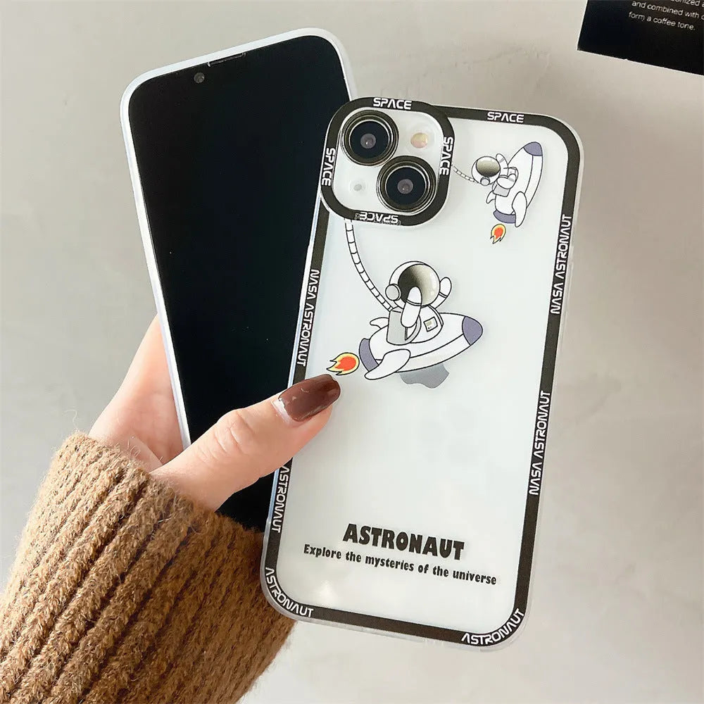 Clear silicone phone case with blue astronaut print, shown fitted on an iPhone.