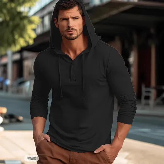 Man wearing a dark blue cotton pullover hoodie top with long sleeves, showing loose casual fit.