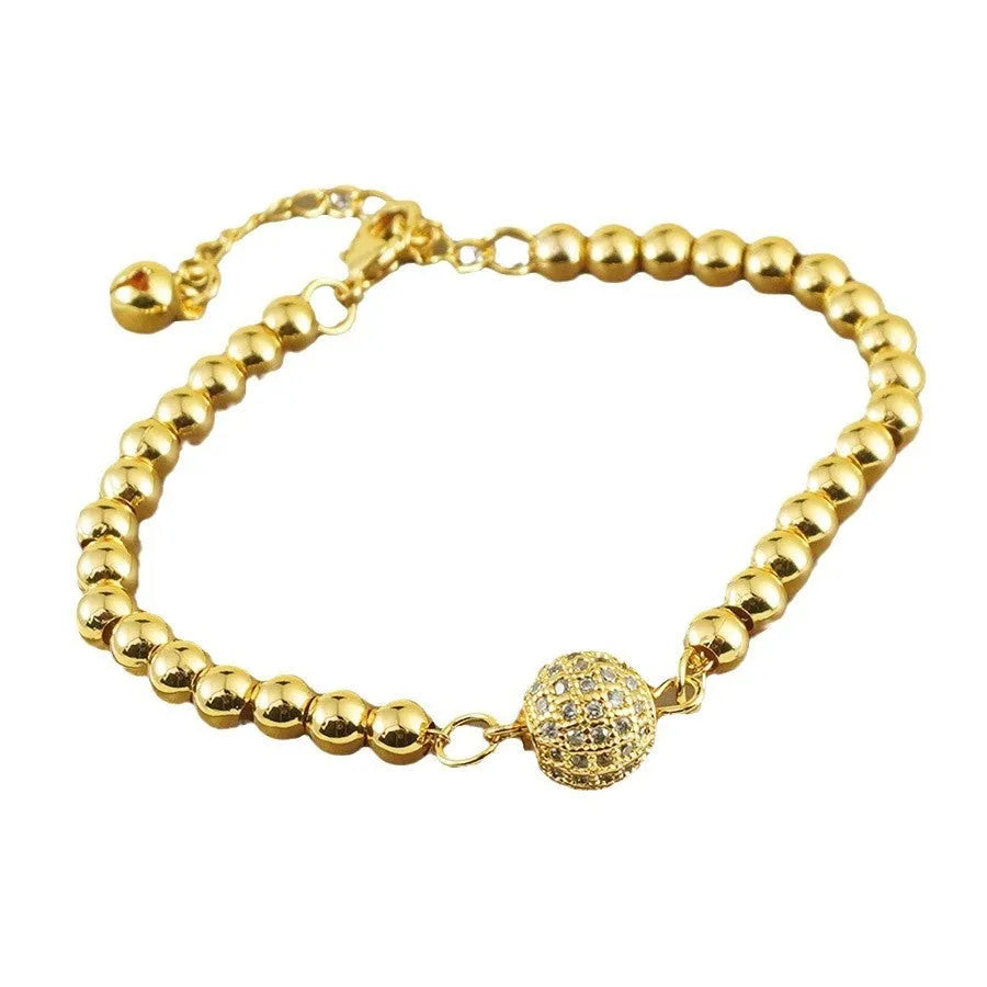 Women's heart-shaped copper bracelet with a single round zircon stone.