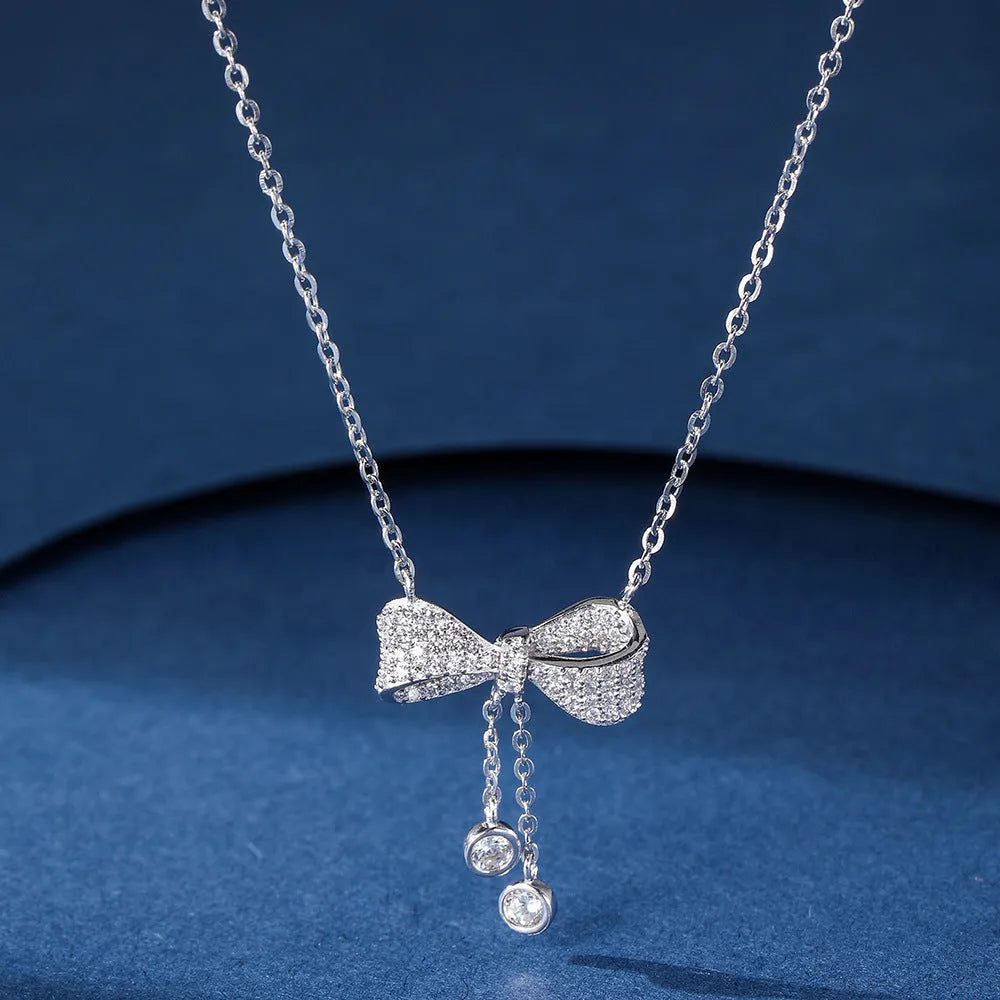 S925 sterling silver necklace with bow pendant on O-ring chain, silver colour.