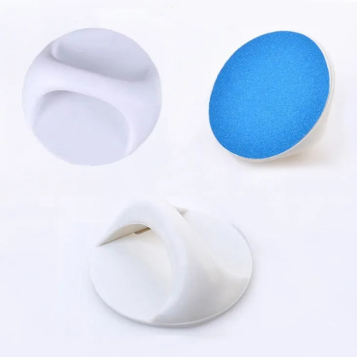 Round blue dog nail file board with an ergonomic handle on a table.