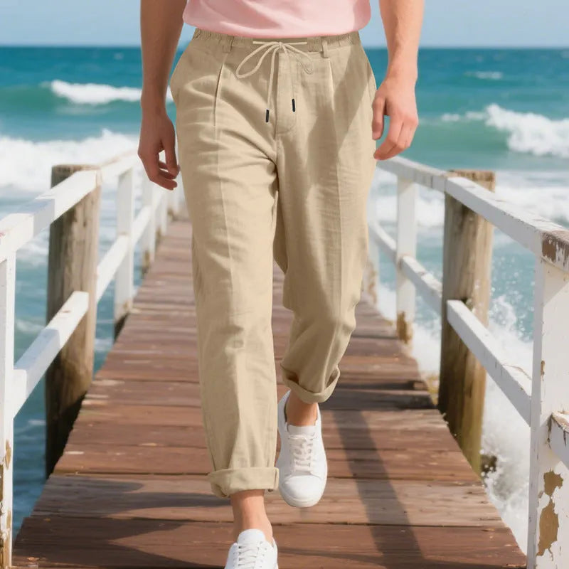 Men's light khaki linen casual trousers with a loose straight-leg fit and drawstring waist.