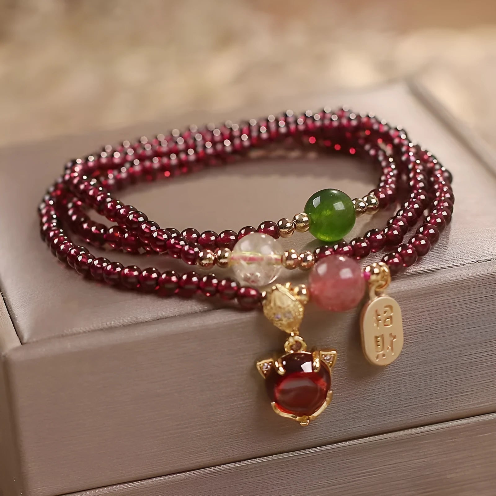 Purplish red garnet fox bracelet with adjustable rope closure and nature-inspired charm