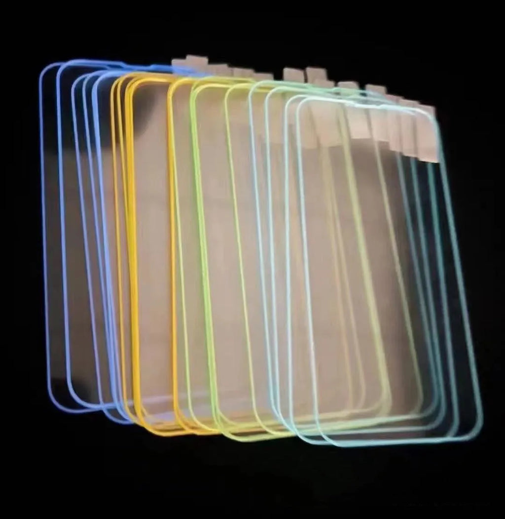 Fluorescent luminous tempered glass screen protector for iPhone on a phone.