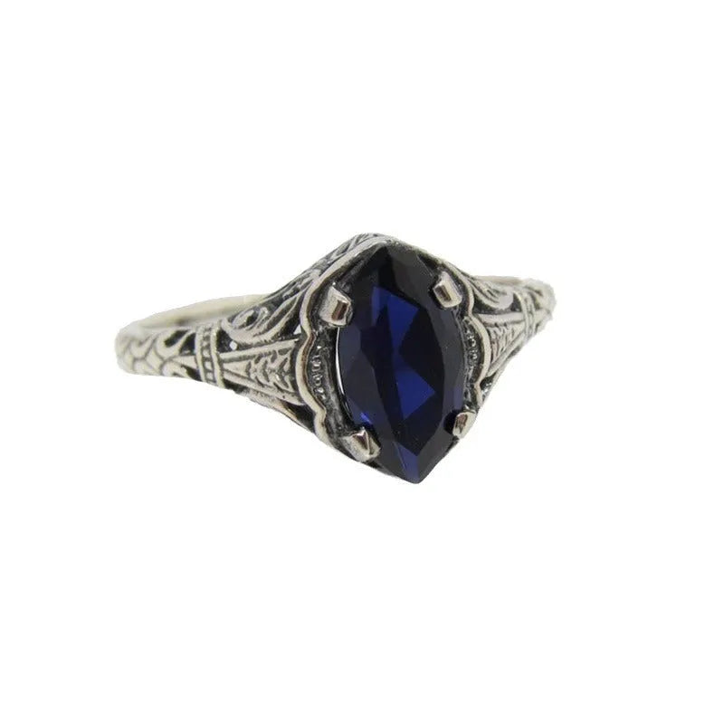 Silver geometric hollow women's ring on a hand, showing its alloy and electroplated construction.