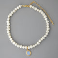 Silver necklace with round medal pendant and irregular pearl charm on adjustable 21-50cm chain