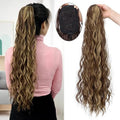 Long synthetic hair extension with water ripple curly texture in a dark colour, featuring a drawstring ponytail base.
