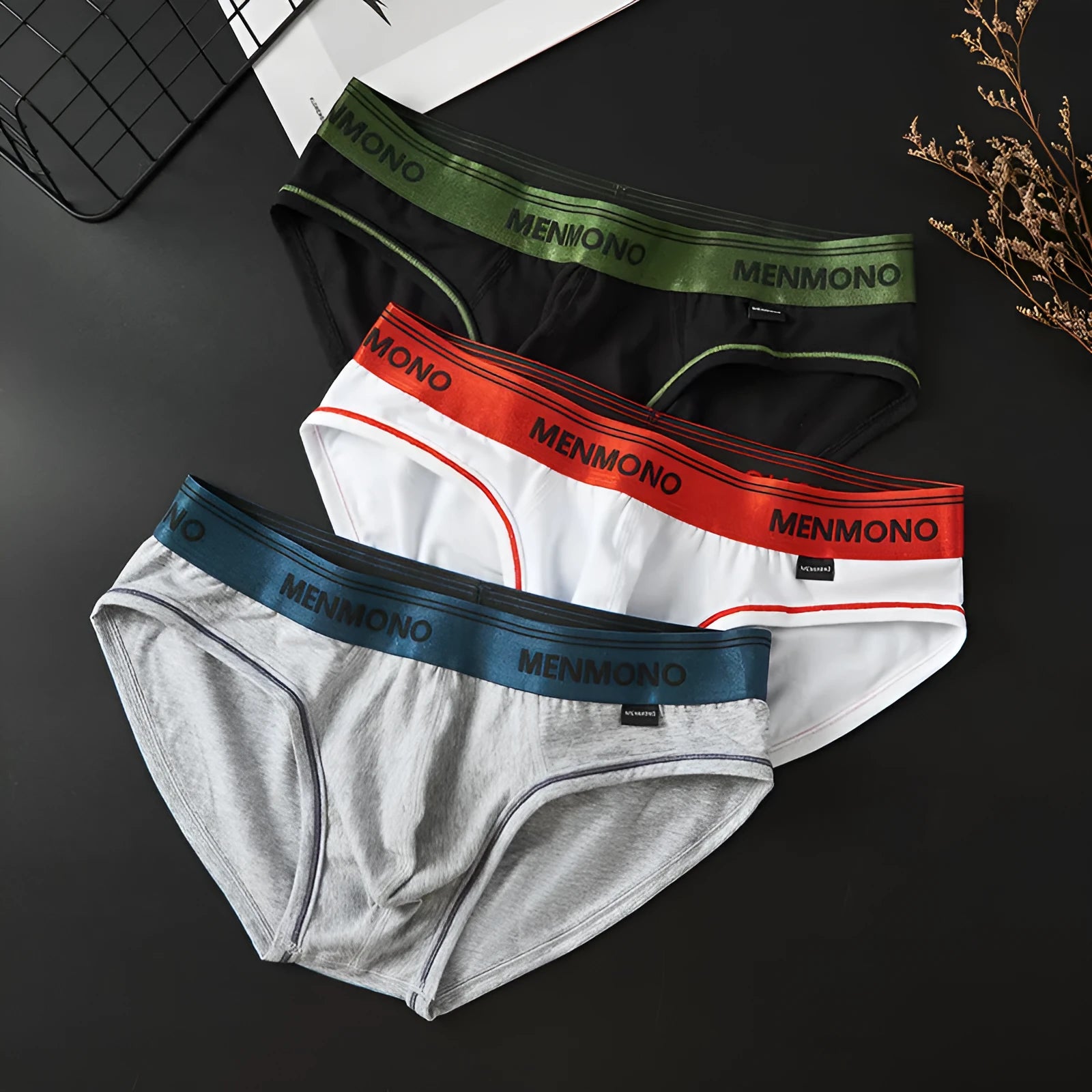 Men's low waist cotton briefs in a grey and red colour-block pattern.