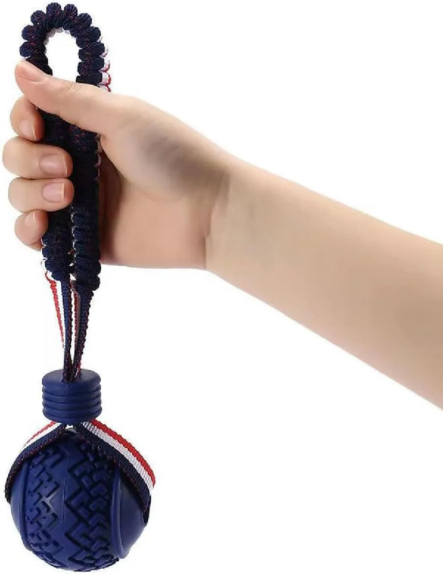 Blue natural rubber dog ball with rope toy showing textured surface, sized for medium and small dog breeds