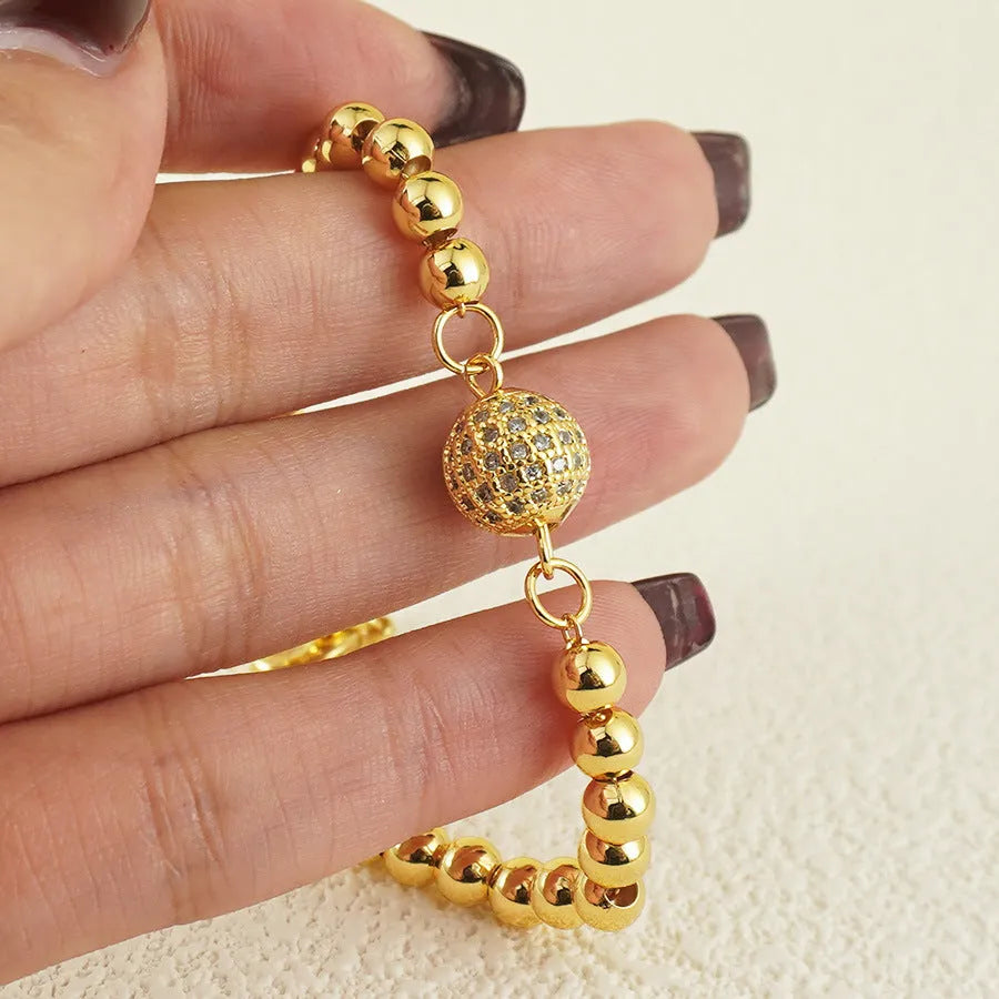 Women's heart-shaped copper bracelet with a single round zircon stone.