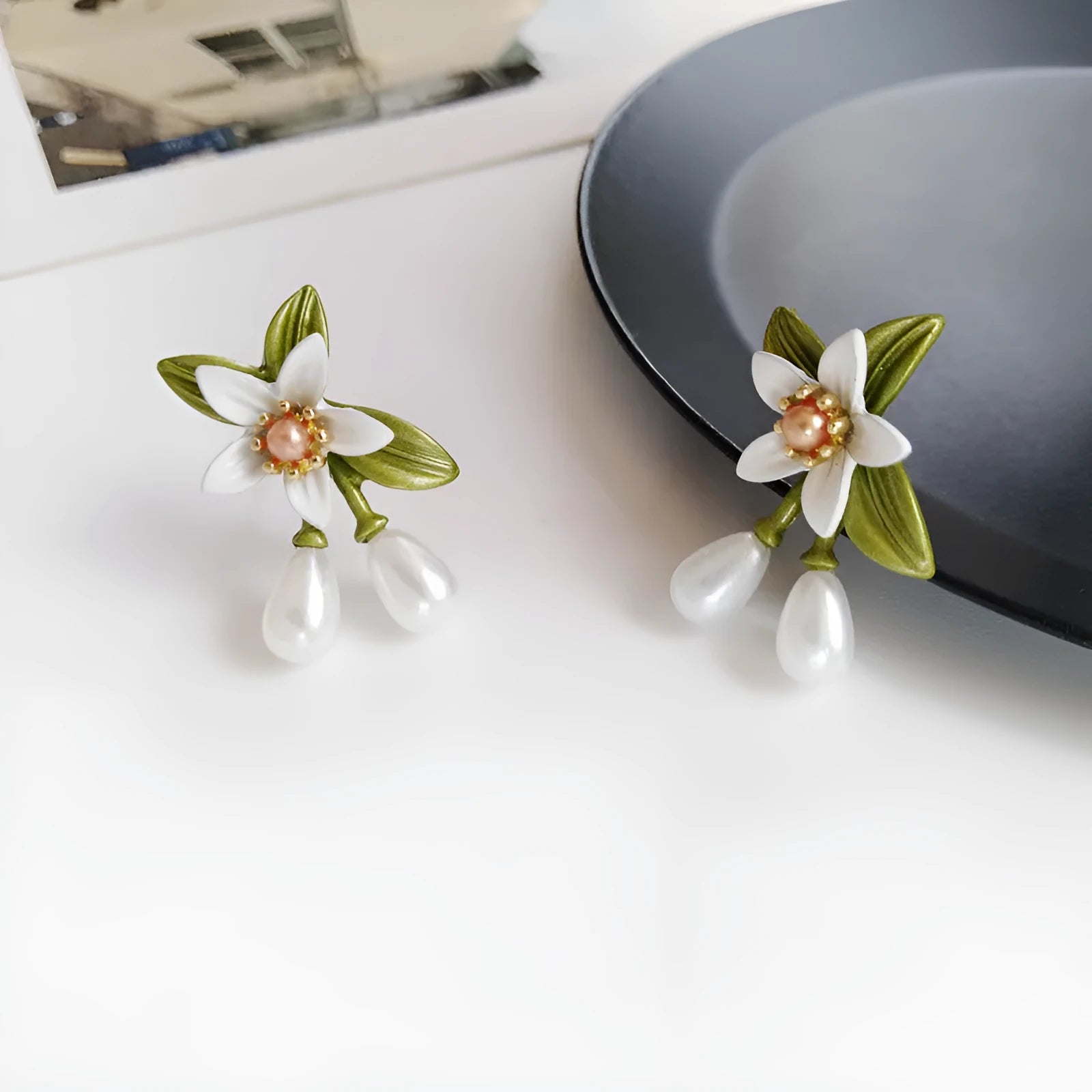 Alloy camellia flower earrings with colour contrast design showing both ear stud and ear clip configurations