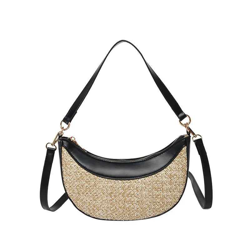 Woven straw dumpling-shaped crossbody bag with adjustable shoulder strap and internal organisational compartments