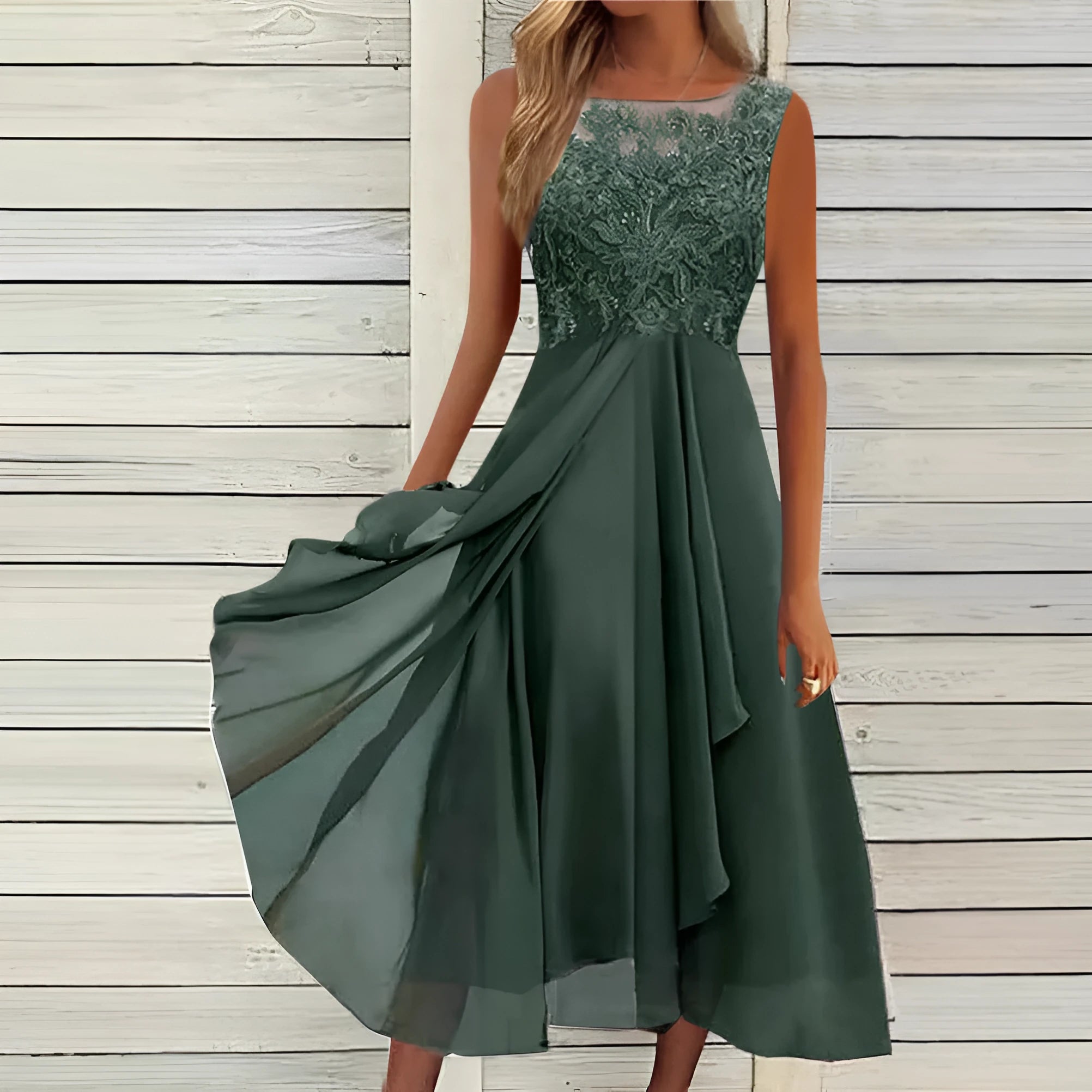Women's sleeveless green chiffon dress with lace hollow-out detail and a mid-length flared skirt.