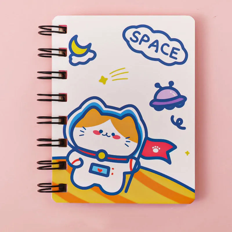 Small astronaut-themed flipper notebook showing one of four cover designs: Astronaut Bear, Planet Teddy, Space Cat, or UFO.