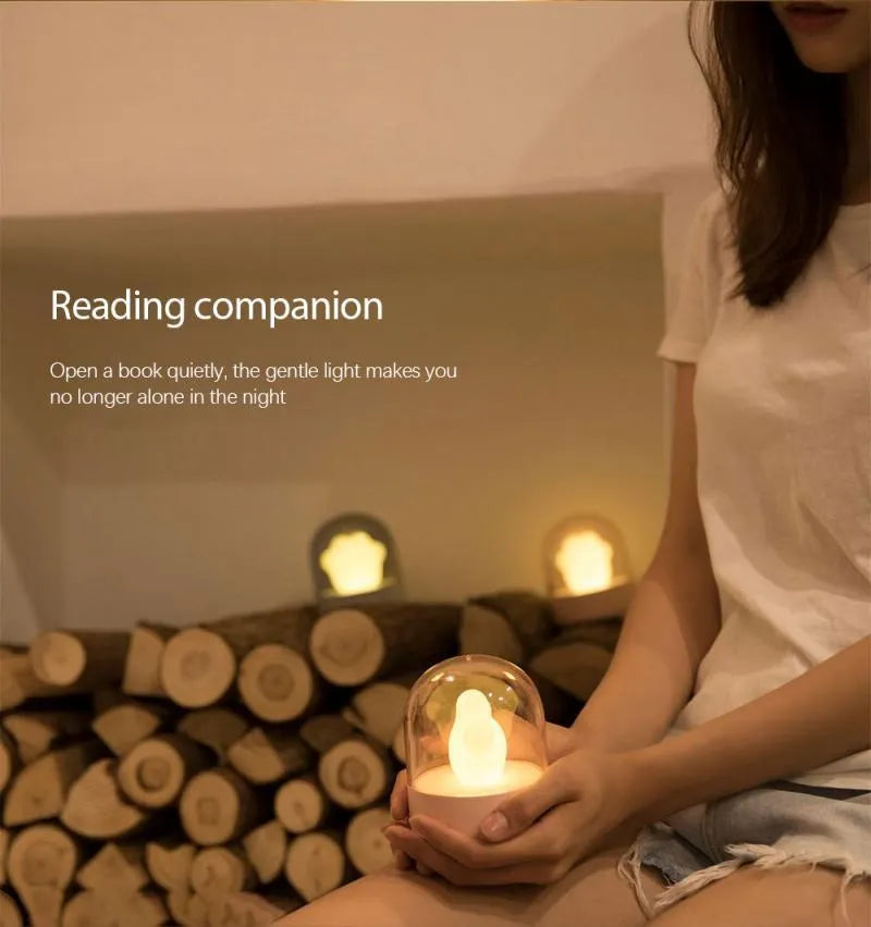 Cat paw-shaped night light with music box function showing pink colour option with illuminated soft light