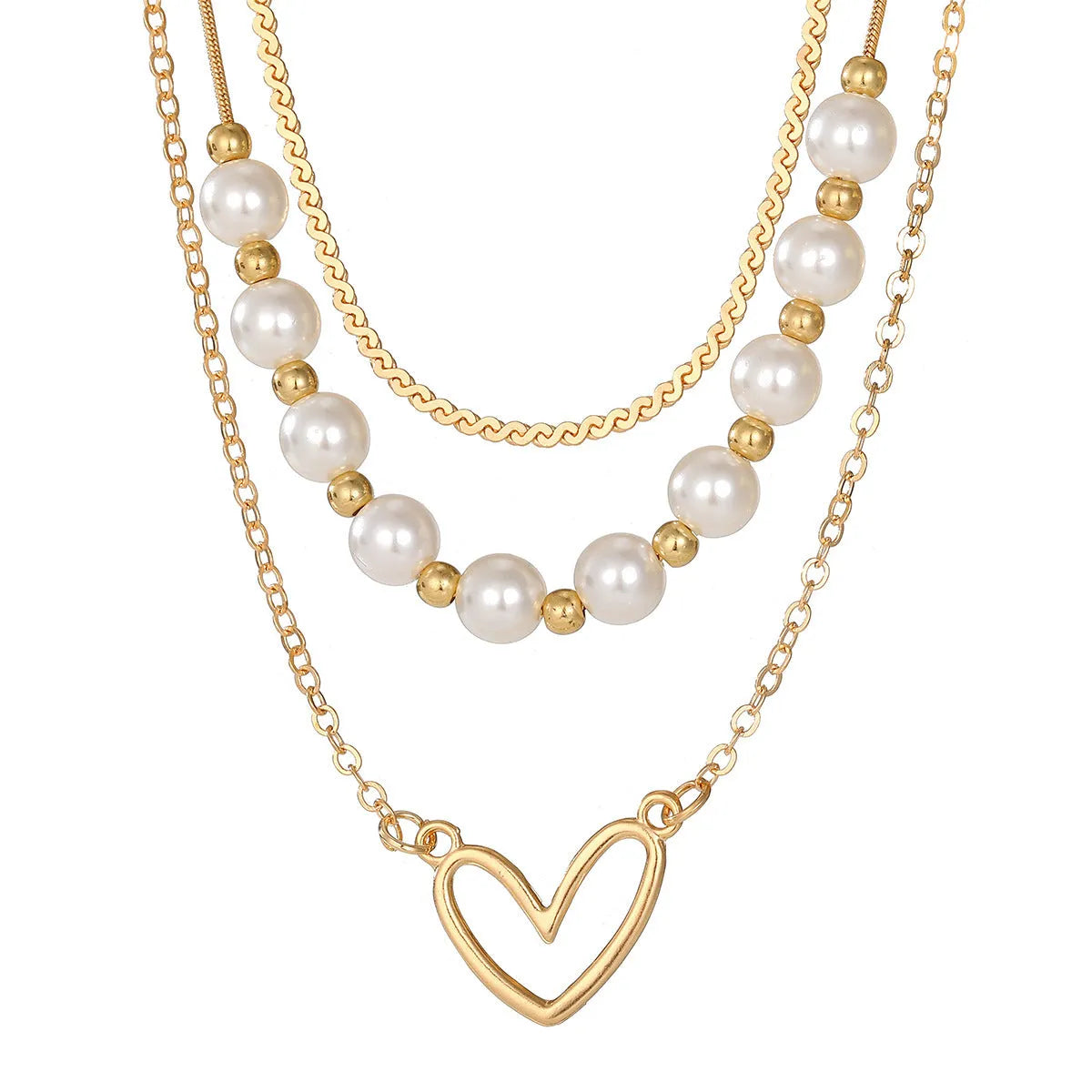 Vintage gold necklace with heart pendant and pearl details on chain