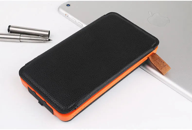 Outdoor solar power bank in multiple colours with solar panel, LED light, and leather casing.