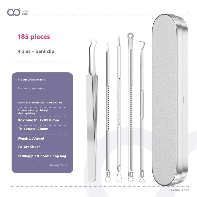 Four silver metal acne needles with pointed tips laid out on a surface.