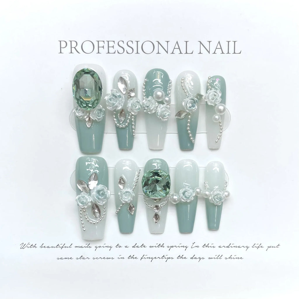 Full diamond camellia gradient nail armour set with bow and butterfly patterns in blush tones