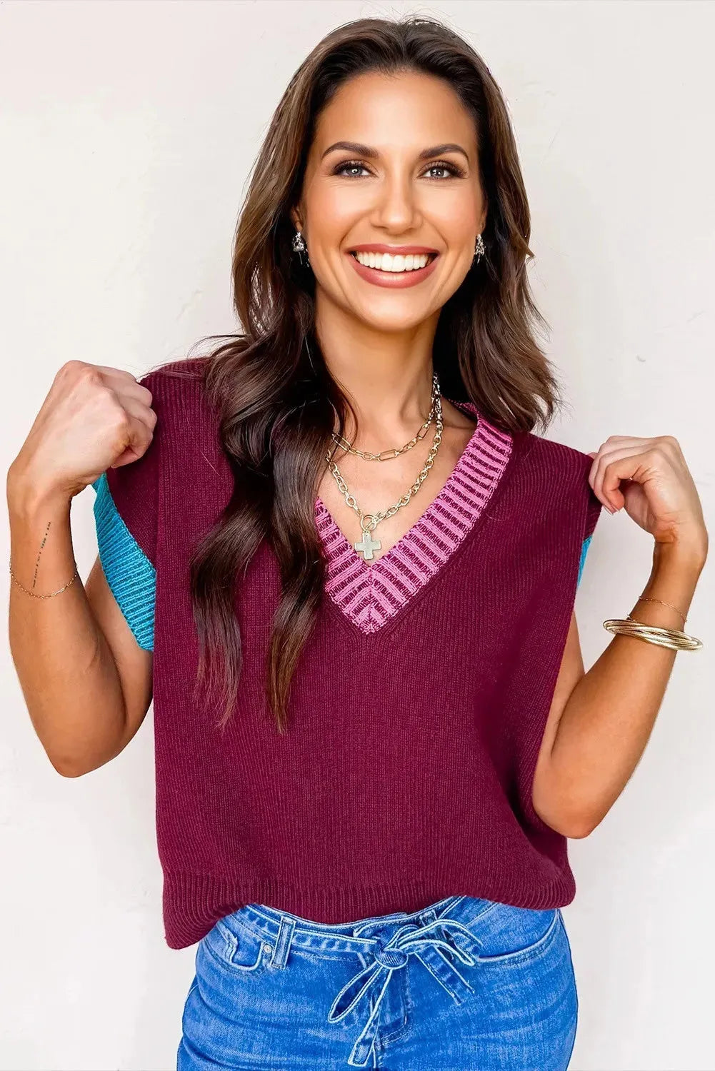 Burgundy loose V-neck sweater with contrast trim on short cuffed sleeves