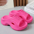 Women's EVA thick-soled slippers in white, black, and rose red colours with round toe design