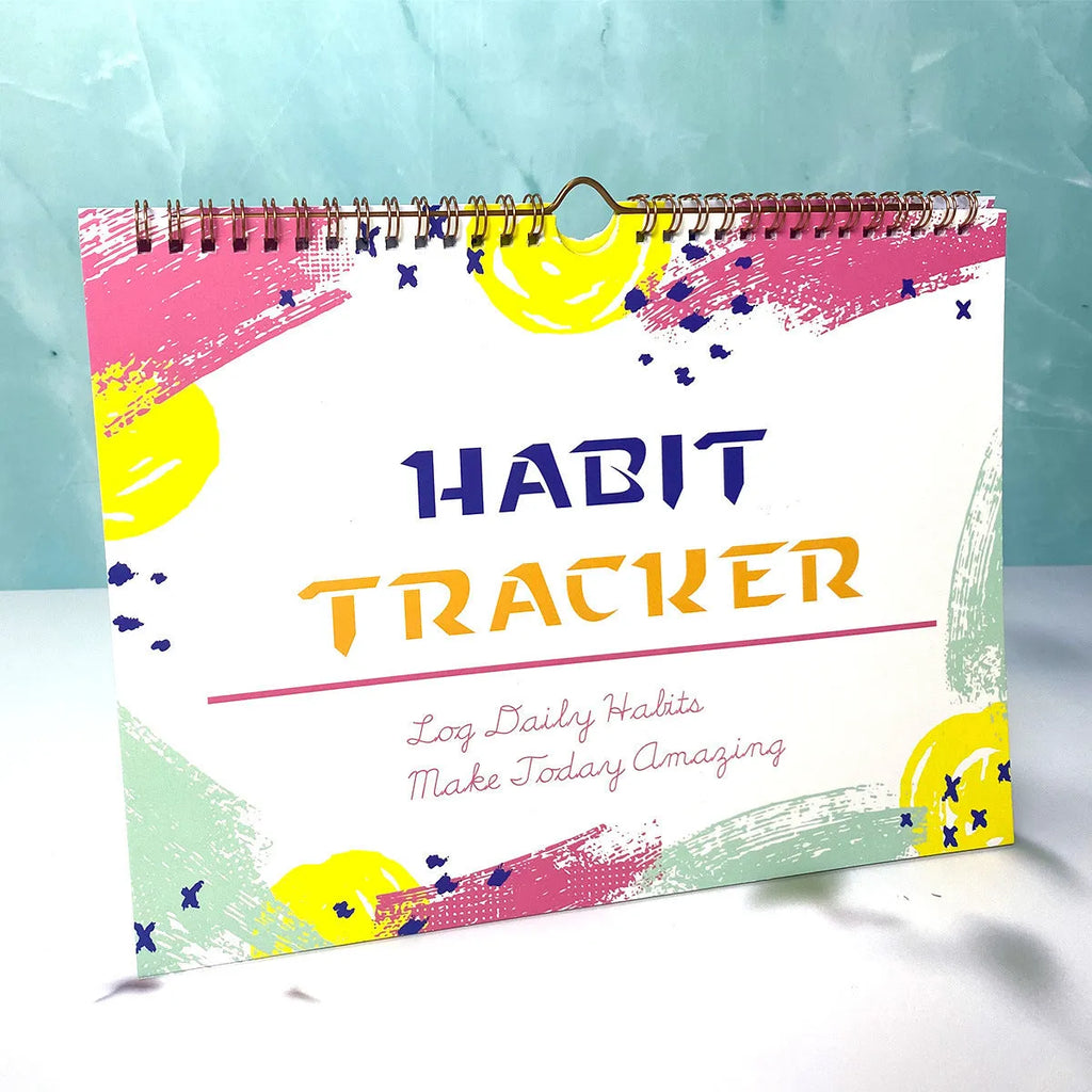 Habit tracking book with 12 pages showing colour options and 21x28cm size
