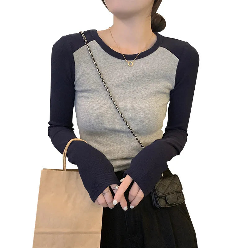 Women's dark blue viscose top with long princess sleeves and embroidery detail on front.