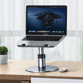 Silver aluminium car laptop stand shown at an adjusted height on a surface.