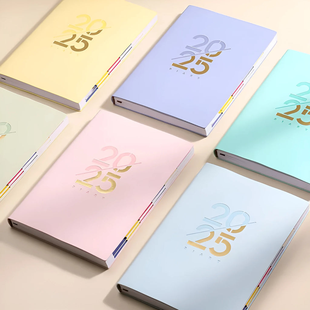Soft cover A5 daily planner schedule book in blue, showing lay-flat binding and faux leather texture.
