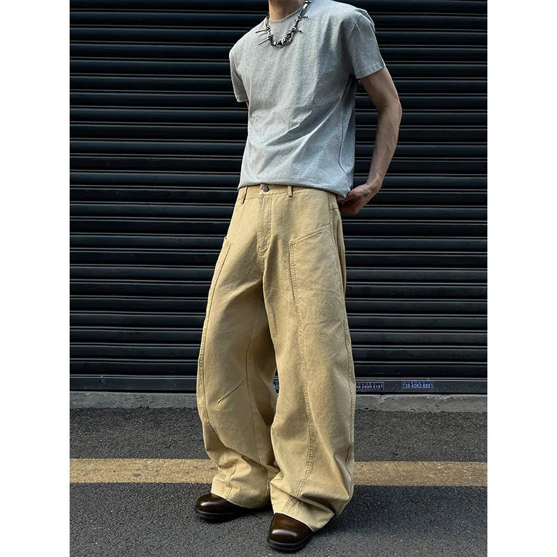 Men's khaki straight-leg cotton trousers laid flat, showing casual American retro style.