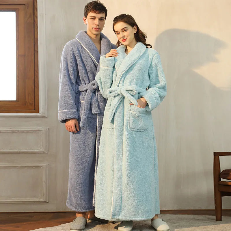 Man and woman wearing a matching thick flannel couple's bathrobe set in a winter colour.